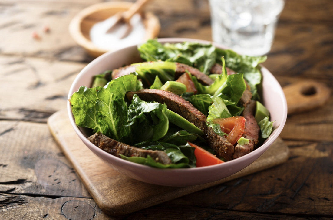 A green salad with grass-fed beef