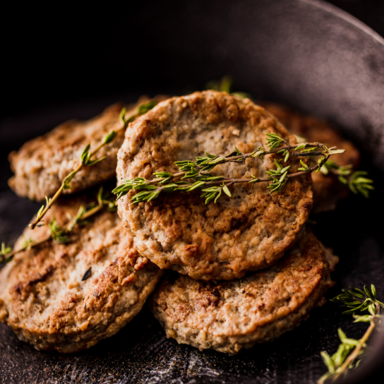 Cooked burgers with herbs